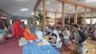 Buddhists Participate in Offering Alms in Celebrating the Beginning of Buddhist Lent